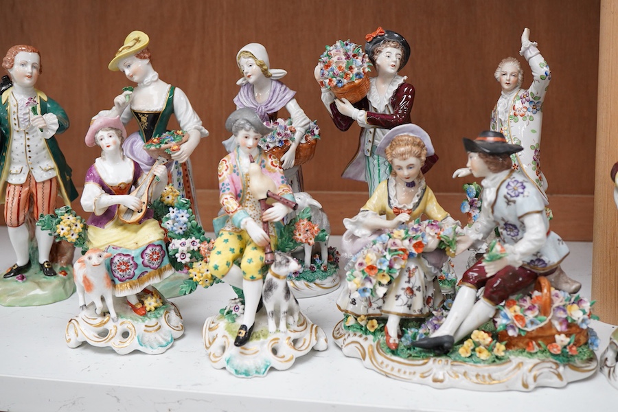 Four pairs of porcelain figures, a single figure and seated figure group, all after Chelsea and Derby originals, together with a Meissen style schneeballen porcelain sucrier and cover, (12)